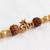 om design rudraksh thread rakhi with roli chawal chandan mishri