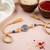 round artificial stones & beads brown thread rakhi with roli chawal chandan mishri