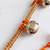 golden ghungroo thread rakhi with roli chawal chandan mishri
