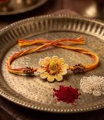 yellow floral seed thread rakhi with roli chawal chandan mishri