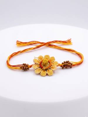 yellow floral seed thread rakhi with roli chawal chandan mishri 2