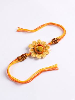 yellow floral seed thread rakhi with roli chawal chandan mishri 4