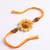 yellow floral seed thread rakhi with roli chawal chandan mishri