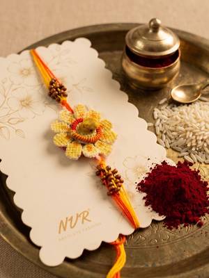 yellow floral seed thread rakhi with roli chawal chandan mishri 5