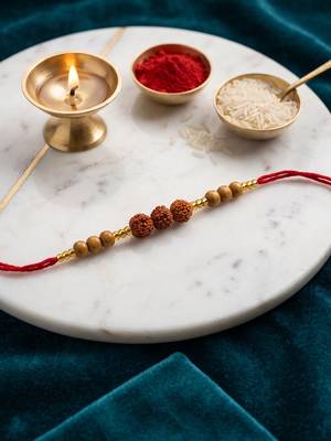 religious rudraksh & red thread rakhi with roli chawal chandan mishri 1