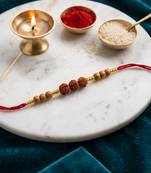 religious rudraksh & red thread rakhi with roli chawal chandan mishri