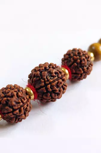 religious rudraksh & red thread rakhi with roli chawal chandan mishri