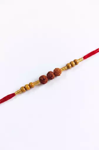 religious rudraksh & red thread rakhi with roli chawal chandan mishri