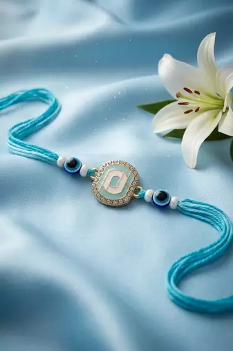 blue evil eye & artificial stones oval shape thread rakhi with roli chawal chandan