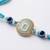 blue evil eye & artificial stones oval shape thread rakhi with roli chawal chandan