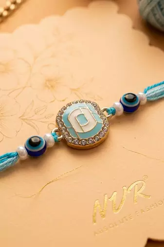 blue evil eye & artificial stones oval shape thread rakhi with roli chawal chandan