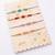 set of 4 multicolor artificial beads thread rakhi with roli chawal chandan mishri
