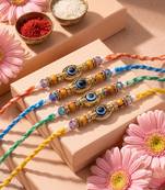set of 4 multicolor evil eye thread rakhi with roli chawal chandan mishri