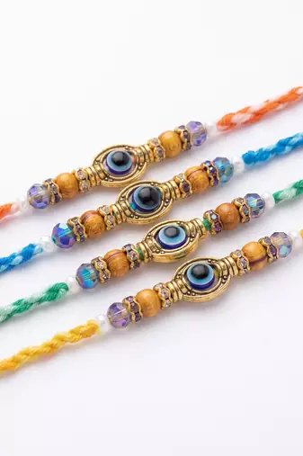 set of 4 multicolor evil eye thread rakhi with roli chawal chandan mishri