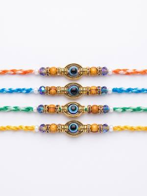 set of 4 multicolor evil eye thread rakhi with roli chawal chandan mishri 4