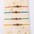 set of 4 multicolor evil eye thread rakhi with roli chawal chandan mishri