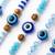 set of 5 blue evil eye thread rakhi with roli chawal chandan mishri