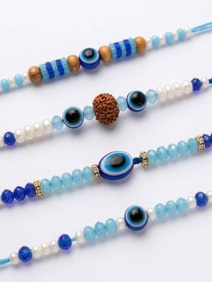 set of 4 blue evil eye thread rakhi with roli chawal chandan mishri 3
