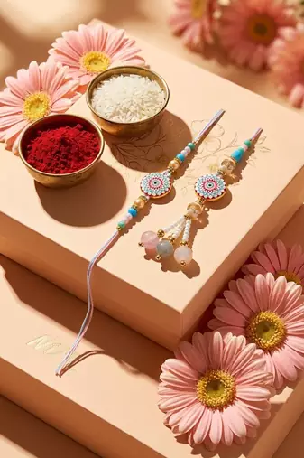 set of 2 floral design bhaiya bhabhi rakhi with roli chawal chandan mishri
