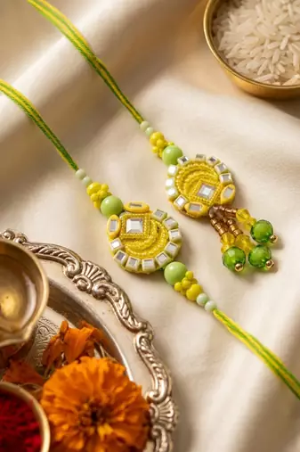 set of 2 artificial beads mirror work bhaiya bhabhi rakhi with roli chawal chandan