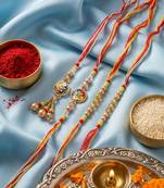 set of 4 artificial beads family pack thread rakhi with roli chawal chandan mishri