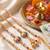 set of 4 artificial beads family pack thread rakhi with roli chawal chandan mishri