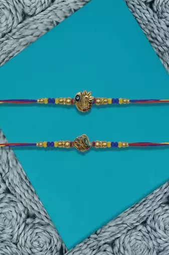 set of 2 peacock design thread rakhi with roli chawal chandan mishri