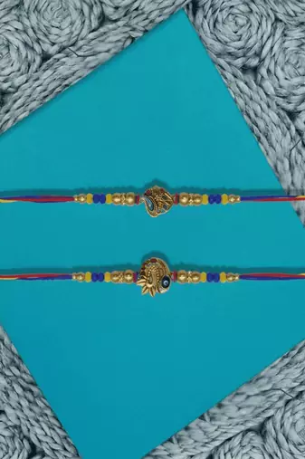 set of 2 peacock design thread rakhi with roli chawal chandan mishri