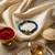 magnetic opening blue meenakari work thread rakhi with roli chawal chandan mishri