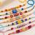 set of 7 multicolor designer thread rakhi with roli chawal chandan mishri