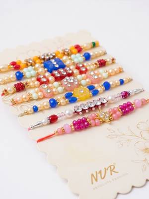 set of 7 multicolor designer thread rakhi with roli chawal chandan mishri 4