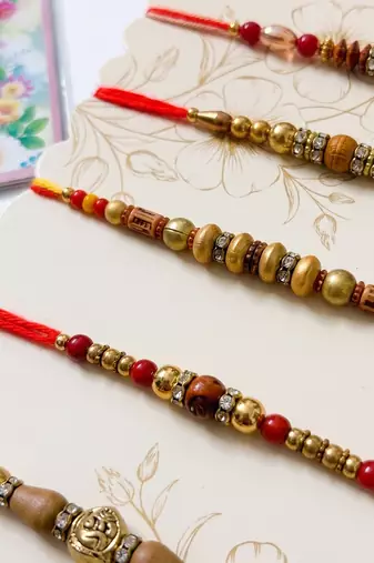 set of 5 multicolor designer thread rakhi with roli chawal chandan mishri