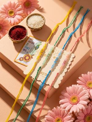 set of 4 multicolor artificial beads thread rakhi with roli chawal chandan mishri 1