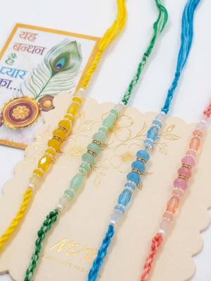 set of 4 multicolor artificial beads thread rakhi with roli chawal chandan mishri 4
