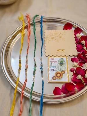 set of 4 multicolor artificial beads thread rakhi with roli chawal chandan mishri 4