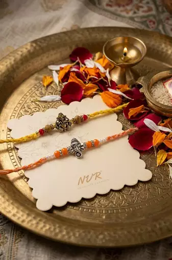 set of 2 multicolor religious thread rakhi with roli chawal chandan mishri
