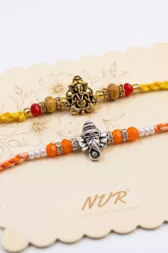 set of 2 multicolor religious thread rakhi with roli chawal chandan mishri