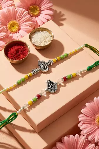 set of 2 multicolor religious thread rakhi with roli chawal chandan mishri