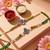 set of 2 multicolor religious thread rakhi with roli chawal chandan mishri