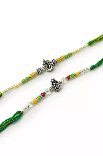set of 2 multicolor religious thread rakhi with roli chawal chandan mishri
