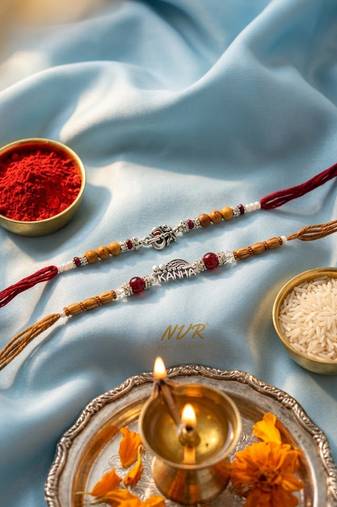 set of 2 silver toned religious rakhi thread rakhi roli chawal chandan mishri