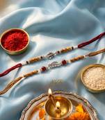 set of 2 silver toned religious rakhi thread rakhi roli chawal chandan mishri