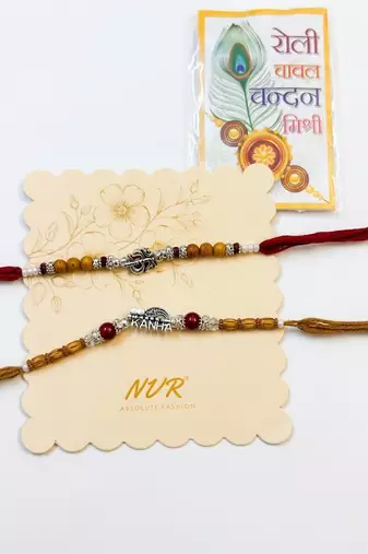 set of 2 silver toned religious rakhi thread rakhi roli chawal chandan mishri