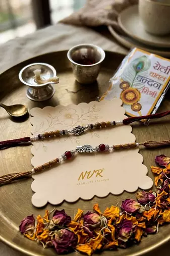 set of 2 silver toned religious rakhi thread rakhi roli chawal chandan mishri
