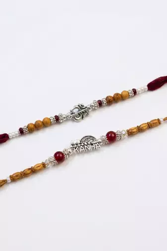 set of 2 silver toned religious rakhi thread rakhi roli chawal chandan mishri