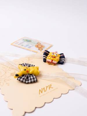 set of 2 pikachu design kids rakhi with roli chawal chandan mishri 4
