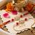 set of 2 artificial stones & beads swastik bhaiya bhabhi rakhi with roli chawal