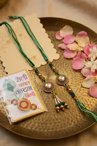 set of 2 ad drawstring bhaiya bhabhi rakhi with roli chawal chandan mishri