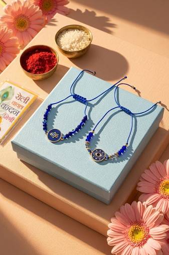 set of 2 blue evil eye thread rakhi with roli chawal chandan mishri