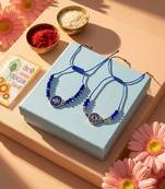 set of 2 blue evil eye thread rakhi with roli chawal chandan mishri